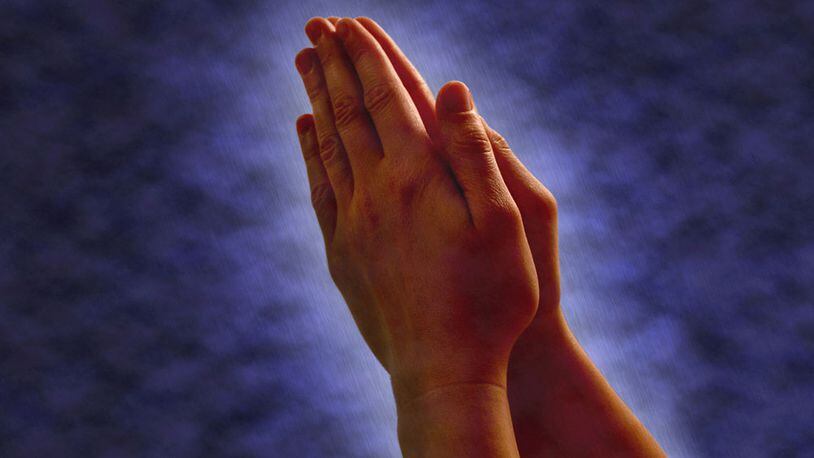 File photo of praying hands