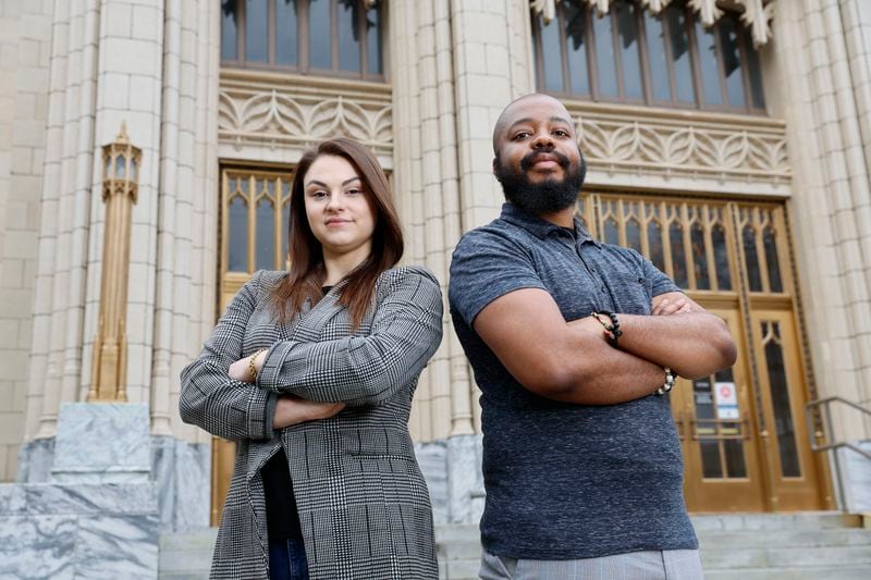 Captured in front of the emblematic Atlanta City Hall, Atlanta Journal-Constitution's City Hall reporters Wilborn P. Nobles III (L) and Riley Bunch proudly showcase their commitment to bringing the latest and most accurate news to their readers. Miguel Martinez /miguel.martinezjimenez@ajc.com