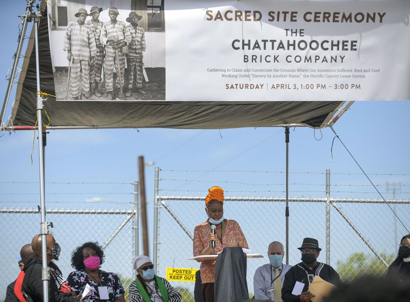 Community representative Gina Bilingsly addresses the crowd gathered at the site of the former Chattahoochee Brick Company during a sacred event to commemorate the lives lost during the period the company used the convict lease system. The event included a procession, prayers, libations, community testimonials and site consecration Saturday, April 3, 2021, in Atlanta. (Photo: Daniel Varnado for The Atlanta Journal-Constitution)