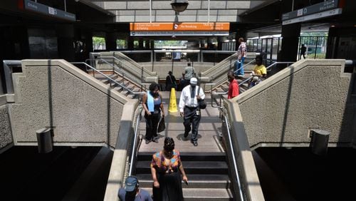 Marta customers walk down to train platform at College Park MARTA station on Saturday, August 9, 2014. For the second consecutive year, it won a “Lyftie” award as one of the hottest spots in Atlanta for passenger dropoffs by the on-demand, ride share service. HYOSUB SHIN / HSHIN@AJC.COM