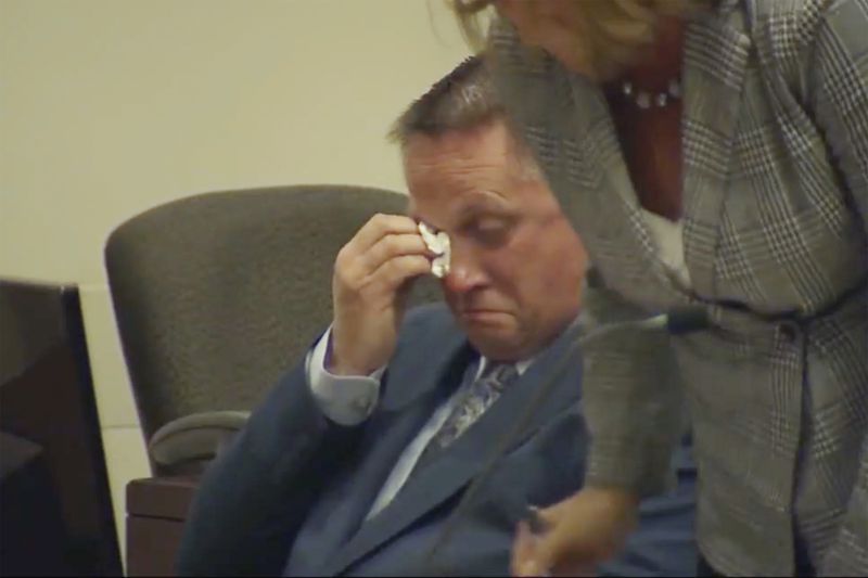 Former paramedic Jeremy Cooper, who injected Elijah McClain with ketamine before his death, wipes his eyes as he sits in court for sentencing, Friday, April 26, 2024, in the Brighton, Colo. Cooper was convicted last year of criminally negligent homicide in the Black man's death, which helped fuel the 2020 social justice protests. (ABC News One/Pool via AP)