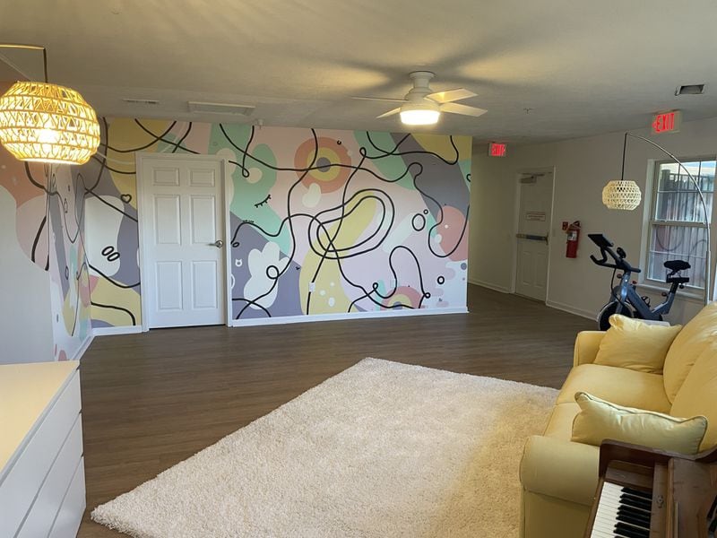 The common area of Tharros Place includes a bright mural painted by a Savannah College of Art and Design alum. The facility is a home for survivors of human trafficking and at-risk girls. (Photo courtesy of Tharros Place)