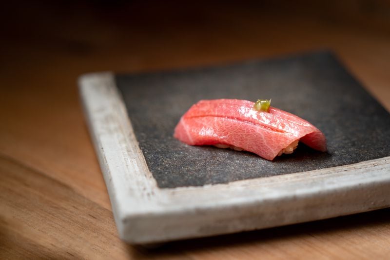 A piece of sashimi from Omakase by Yun, a restaurant that opened late last week with an 18-course omakase experience by sushi chef Jonathan Yun.