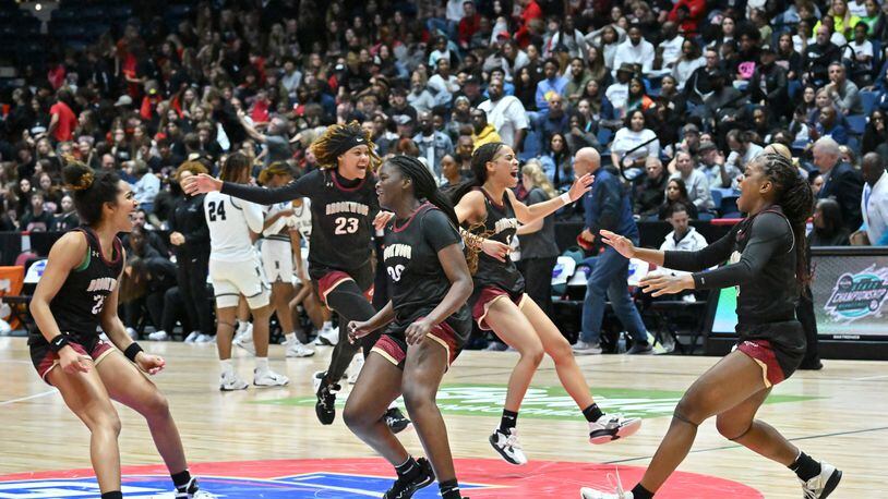 Brookwood players celebrate at the end of the 4th quarter during 2023 GHSA Basketball Class 7A Girl’s State Championship game at the Macon Centreplex, Saturday, March 11, 2023, in Macon, GA. (Hyosub Shin / Hyosub.Shin@ajc.com)