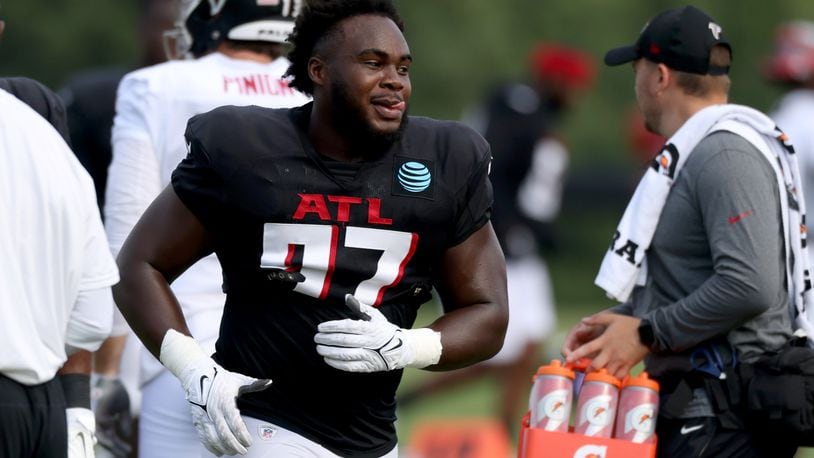 Hall of Famer Bryant Young, who coached the Falcons’ defensive line from 2017-19, had an impact on Grady Jarrett (97). (Jason Getz / Jason.Getz@ajc.com)
