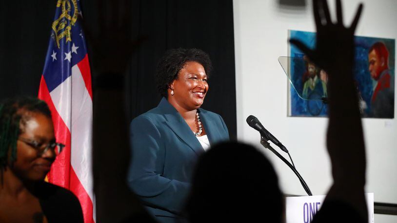 080922 Atlanta: A supporter waves as Democratic nominee for Governor Stacey Abrams concludes her economic address outlining her vision for Georgia’s economy on Tuesday, August 9, 2022, in Atlanta.   “Curtis Compton / Curtis Compton@ajc.com