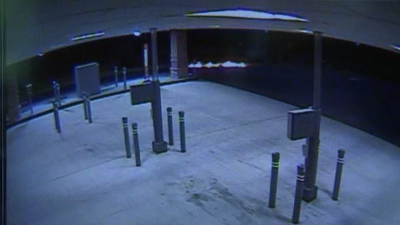 Authorities are searching for two masked men caught on camera burning ATMs. (Credit: Channel 2 Action News)