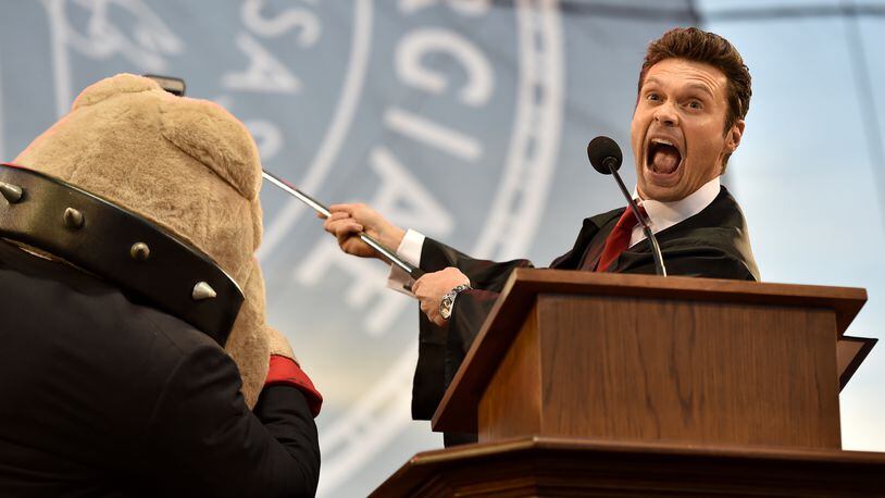 "American Idol" host Ryan Seacrest takes a selfie with UGA mascot Hairy Dawg during his Commencement address. Seacrest, who grew up in Dunwoody, attended UGA briefly before pursuing a broadcasting career. More than 5,500 graduates were eligible to participate in the ceremony. BRANT SANDERLIN/BSANDERLIN@AJC.COM