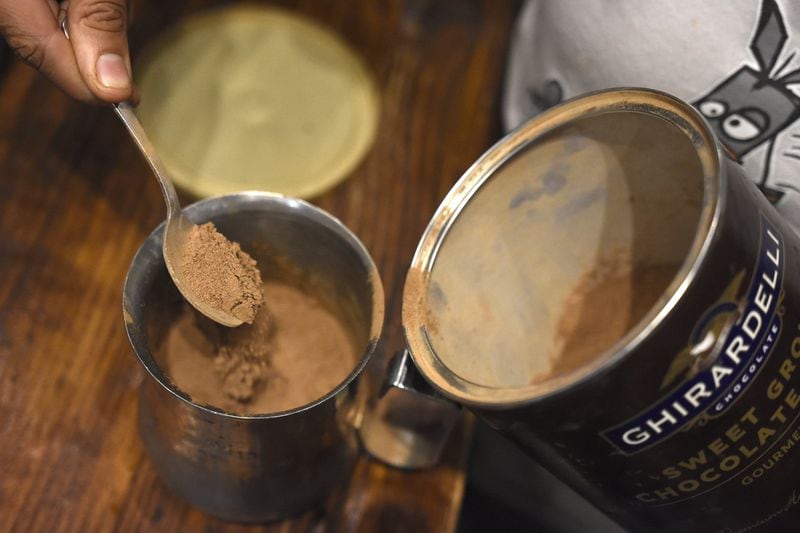 Baristas at Ebrik Coffee Room in Atlanta use Ghirardelli’s sweet ground chocolate and cocoa with steamed milk when making a hot chocolate. DAVID BARNES / DAVID.BARNES@AJC.COM