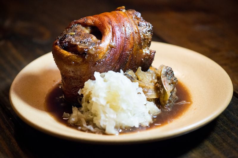 Pork knuckle with sauerkraut and stout gravy. Photo credit: Mia Yakel Photography