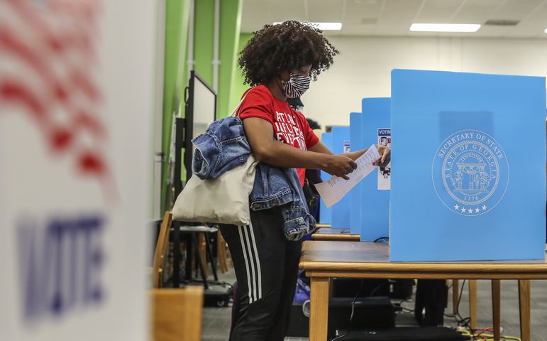 PHOTOS: Georgia voters struggle with long lines, new equipment, social distancing