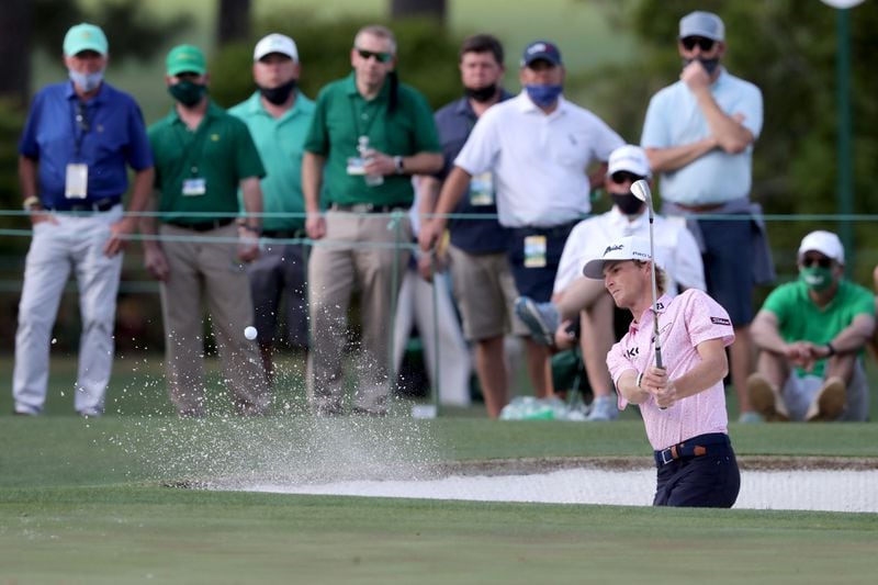 Will Zalatoris hits out of the bunker on the 15th hole during the Masters Tournament Sunday, April 11, 2021, at Augusta National Golf Club in Augusta. (Curtis Compton/ccompton@ajc.com)