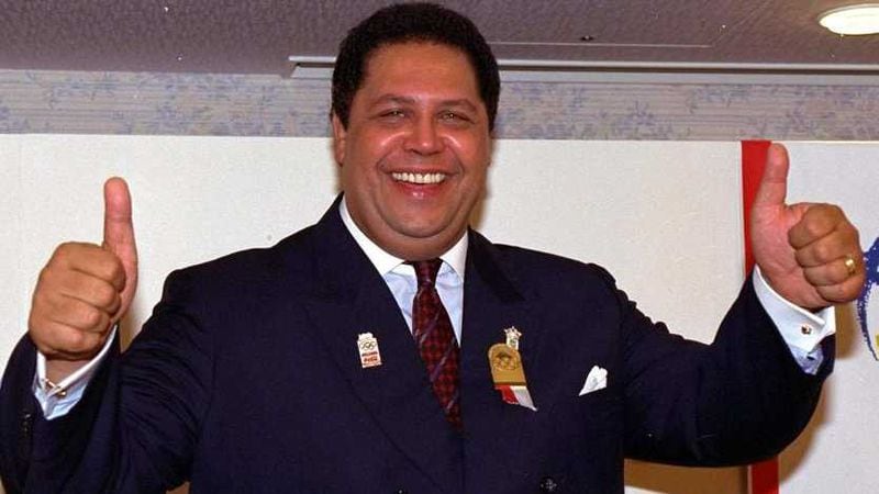Atlanta Mayor Maynard Jackson gives thumbs-up signs at a Tokyo hotel in 1990 after Atlanta won its bid to host the 1996 Centennial Olympic Games. Jackson later said that The Olympics would never have come to the city “if we’d not been able to show that we have a history in Atlanta of acting inclusively.” (Sadayuki Mikami/AP file)