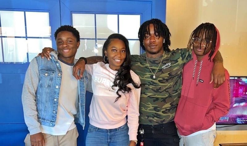 Nasier Fitzgerald, second from right, with his brothers, Samari Bolds, left, Sincere Bolds, right and his mother Tytya Bolds, second from right, two days before he was shot and killed on March 21. Fitzgerald was her oldest child.