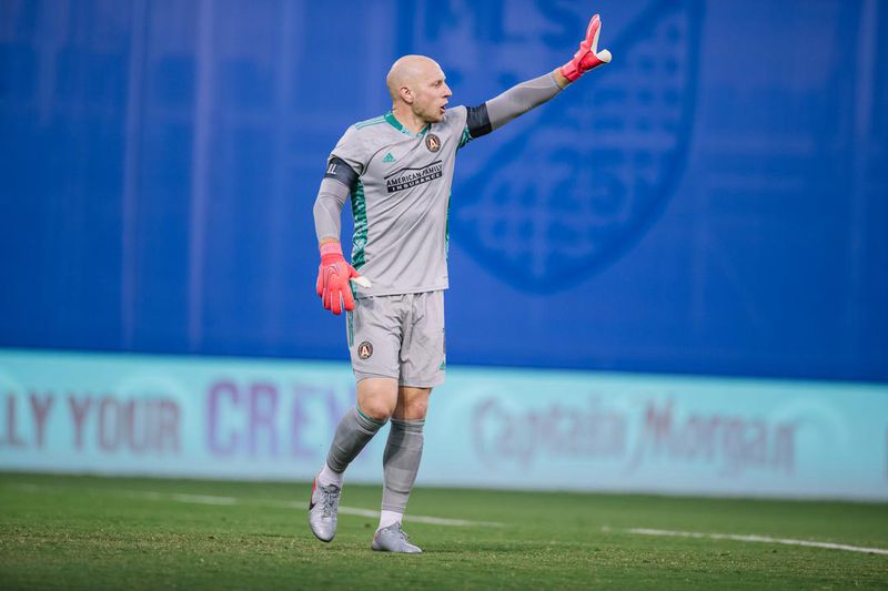 Atlanta United goalkeeper Brad Guzan signals his teammates during 1-0 loss to Columbus Tuesday, July 21, 2020, in the MLS tournament in Orlando, Fla. The loss eliminated Atlanta United from competition.