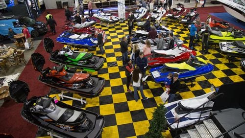 People look over some of the personal watercraft at the 2019 Progressive Atlanta Boat Show at the Georgia World Congress Center in  Atlanta on January 12, 2019. This year’s show opens Jan. 16.  STEVE SCHAEFER / SPECIAL TO THE AJC