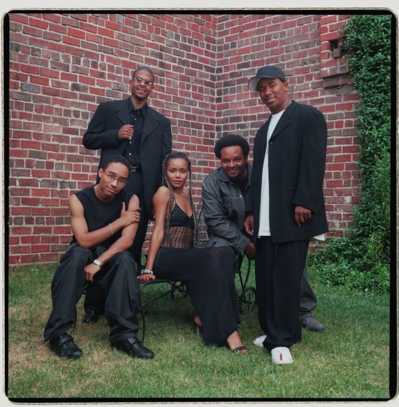 Kawan Prather (far right) in 2000, soon after founding his record label Ghet-O-Vision. He's seen here with four other local music talents: Johnte Austin (from left), Shakir Stewart (standing), Joi and Ian Burke. Photo taken at American Laundry/Walker Street (JOEY IVANSCO/AJC)