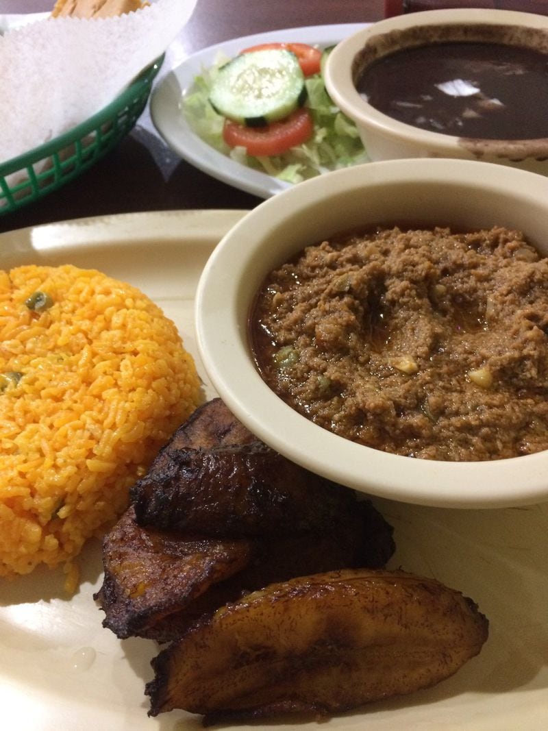 The picadillo dinner plate at Havana Sandwich Shop includes yellow rice, plantains, black beans, salad and buttered bread. CONTRIBUTED BY WENDELL BROCK