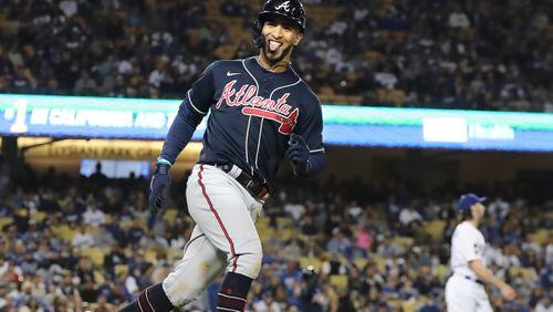 Braves outfielder Eddie Rosario reacts to his 3-run homer in the 9th inning off Dodgers pitcher Tony Gonsolin.   “Curtis Compton / Curtis.Compton@ajc.com”