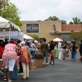People check out booths at the soft opening of the New Black Wall Street Market in Stonecrest, Georgia, on Saturday, May 29, 2021. (Rebecca Wright for the Atlanta Journal-Constitution)