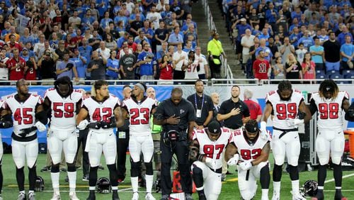 Grady Jarrett and Dontari Poe take a knee during the playing of the national anthem prior to the start of the game against the Detroit Lions  at Ford Field on September 24, 2017 in Detroit, Michigan. (Photo by Leon Halip/Getty Images)