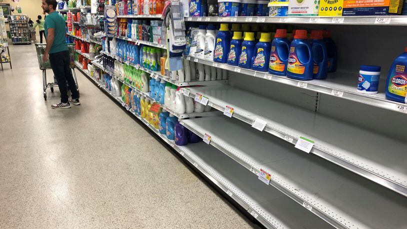 Shortages of particular items have hit grocery store shelves as people have engaged in some hoarding and panic-induced buying because of the spread of COVID-19. In this Publix in Cobb County, all the bleach, which can be used for sanitizing, has been purchased, though the shelves remain full of other clothes cleaning products. Christopher Quinn