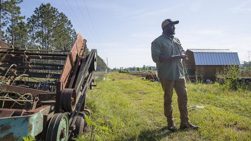 Farmer Sedrick Rowe talks farming at a 10-acre property he is leasing to own in Albany. (ALYSSA POINTER/ALYSSA.POINTER@AJC.COM)
