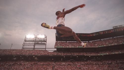 35-year-old Carl Lewis soared to the gold medal in the long jump at the 1996 Olympics in Atlanta. Lewis also won the event in the 1984, 1988 and 1992 Games. (AJC Staff Photo/Rich Addicks)