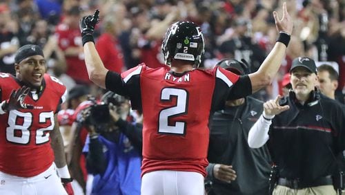 Joshua Perkins, Matt Ryan, and Dan Quinn celebrate taking a 36-13 lead over the Seahawks in the NFC Divisional Playoff game Saturday, Jan. 14, 2017, at what was expected to be the final game at the Georgia Dome. Fate had other plans.