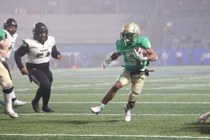 Buford running back CJ Clinkscales (5) scores a touchdown against Langston Hughes during the first half of the Class 6A state title football game at Georgia State Center Parc Stadium Friday, December 10, 2021, Atlanta. JASON GETZ FOR THE ATLANTA JOURNAL-CONSTITUTION
