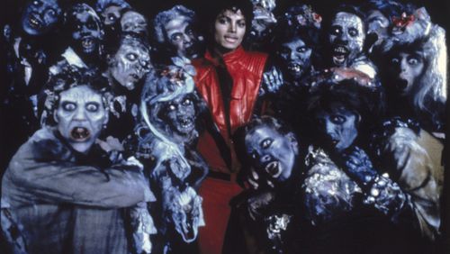 Michael Jackson stands with a group of dancers dressed as zombies while filming his 1983 video 'Thriller.' The song and video remain a Halloween staple.