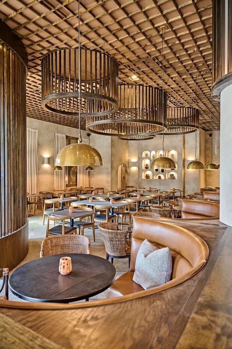 The interior of Casa Balam in Decatur features large wooden light fixtures and big booths. /  Courtesy of Casa Balam