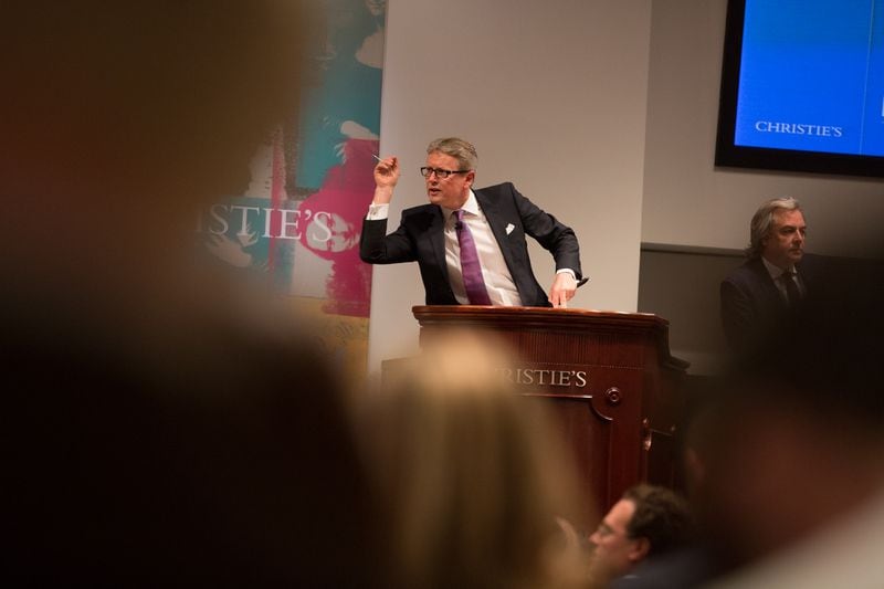An auctioneer leads a sale at Christie's Auction House in New York.