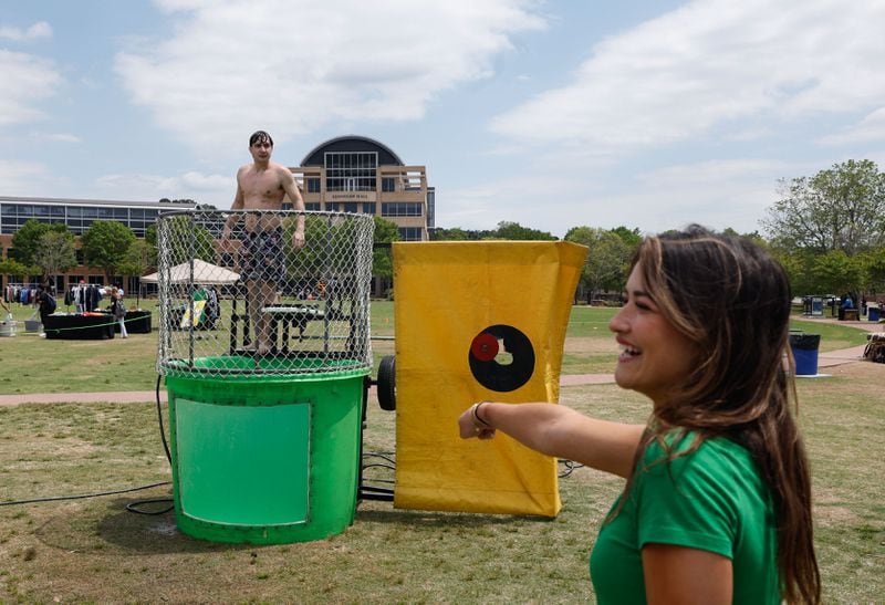 Claire Andres, a sophomore public relations major, attempts to dunk Pi Kappa Phi member Mason Gatlin, a sophomore business management major.