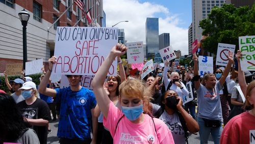Abortion rights activists rally and march in Atlanta on Saturday, May 7, 2022. (Arvin Temkar / arvin.temkar@ajc.com)