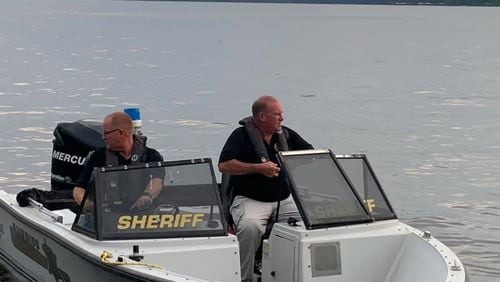 Deputies with the Crisp County Sheriff's Office search Lake Blackshear for Abraham Levy, 25, of Atlanta, whose body was found two days after he disappeared.