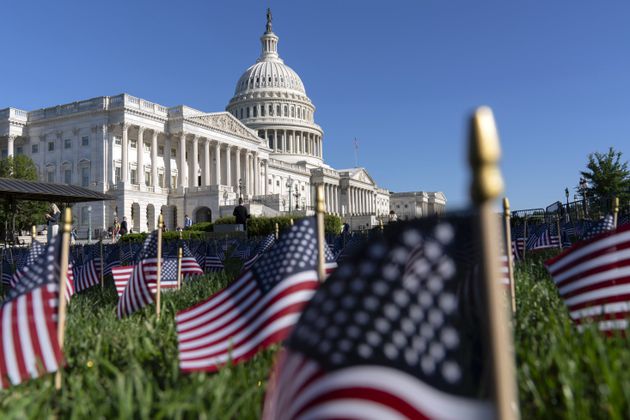 The U.S. Capitol is seen with American flags to honor the law enforcement officers who lost their lives in 2023, during the National Police Week at the U.S. Capitol Thursday, May 16, 2024, in Washington. (AP Photo/Jose Luis Magana)