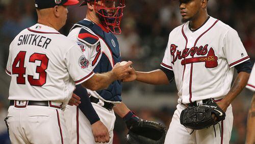 Braves manager Brian Snitker pulls Julio Teheran from the game Thursday against the Blue Jays, when the pitcher allowed nine runs and three homers and left without recording an out in the fourth inning. (Curtis Compton/ccompton@ajc.com)