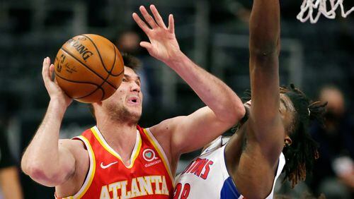 Pistons center Isaiah Stewart (right) takes an elbow to the chin from Hawks forward Danilo Gallinari ( left) during the second quarter Monday, April 26, 2021, in Detroit. (Duane Burleson/AP)