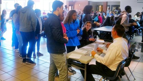 Part of the ongoing education about American government are voter registration drives at Gwinnett County Public Schools. Picture here are students at Duluth High School. PHOTO COURTESY OF GWINNETT COUNTY PUBLIC SCHOOLS