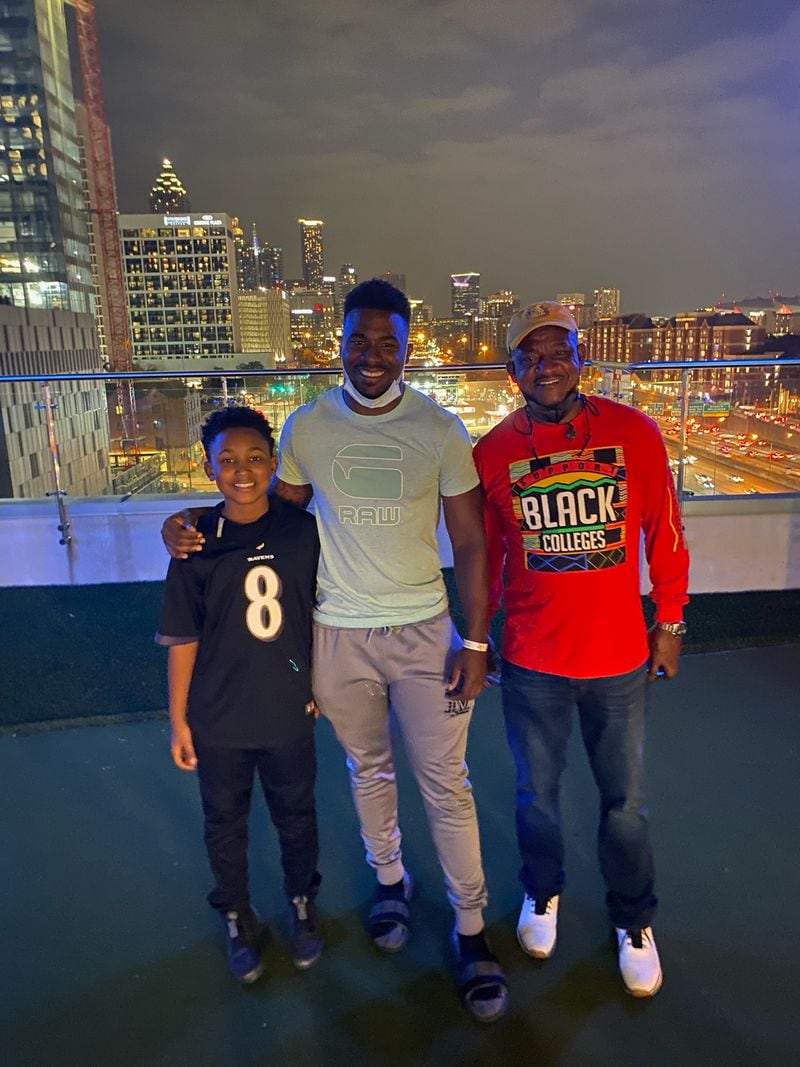 Georgia Tech linebacker Ayinde Eley with his father Donald Hill-Eley and brother Jacob at Eley's apartment in Atlanta in a 2021 photo. Hill-Eley was then the head football coach at Alabama State. (Photo courtesy Donald Hill-Eley)