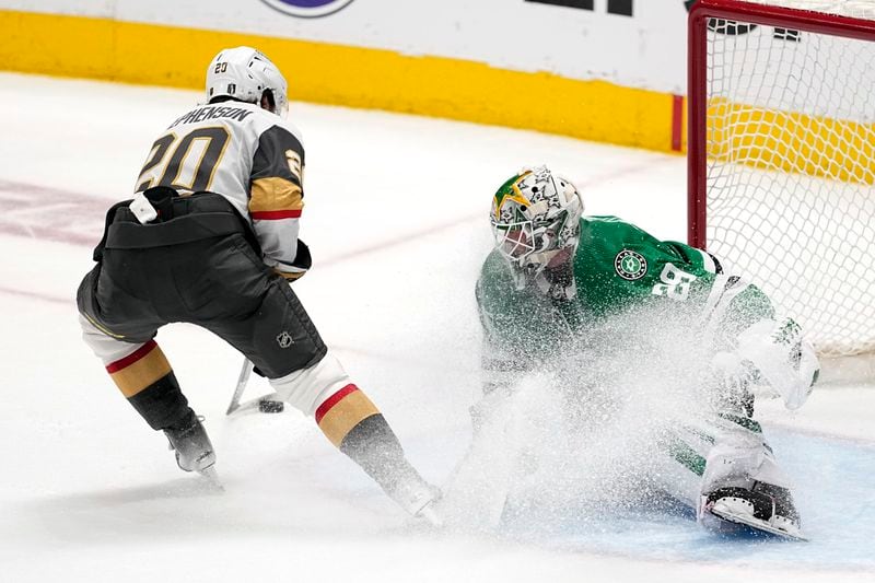 Vegas Golden Knights' Chandler Stephenson prepares to shoot as Dallas Stars goaltender Jake Oettinger (29) defends in the third period in Game 5 of an NHL hockey Stanley Cup first-round playoff series in Dallas, Wednesday, May 1, 2024. (AP Photo/Tony Gutierrez)