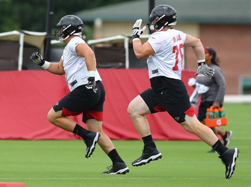 June 12, 2019 Flowery Branch: Atlanta Falcons first round draft picks offensive lineman Chris Lindstrom (left) and offensive tackle Kaleb McGary race each other across the field to the next drill during minicamp on Wednesday, June 12, 2019, in Flowery Branch.  Curtis Compton/ccompton@ajc.com