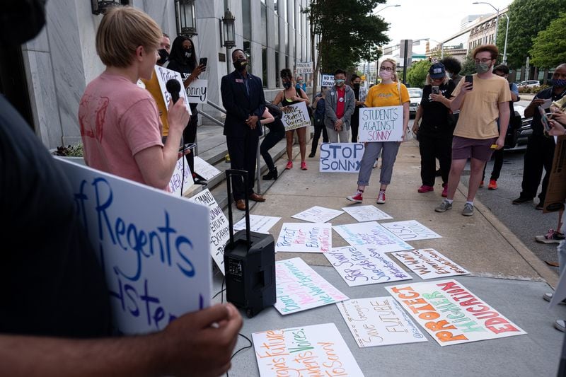 Students gather in front of the University System of Georgia offices in downtown Atlanta on Tuesday afternoon, April 27, 2021, to protest against former Gov. Sonny Perdue becoming the new chancellor. (Ben Gray for The Atlanta Journal-Constitution)