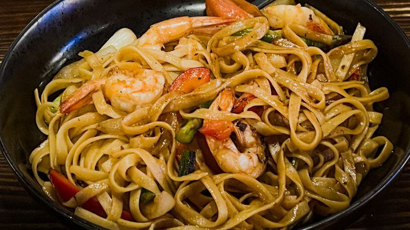 Chinese immigrants had an impact on Peruvian cuisine, and lo mein is one of the wok dishes available at Pisco Latin Kitchen. Henri Hollis/henri.hollis@ajc.com