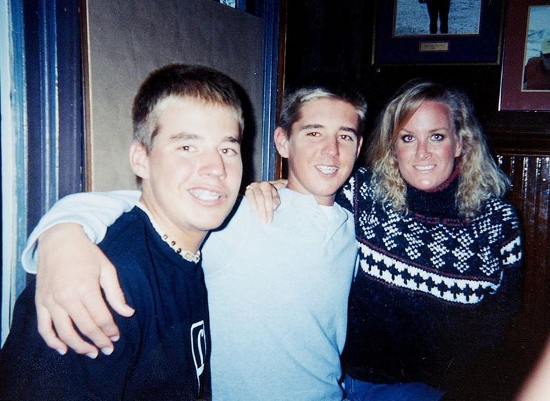Mike Tokars, 14 (left), and Rick Tokars, 16, with their aunt Krissy Ambrusko in November 2002. (SPECIAL)