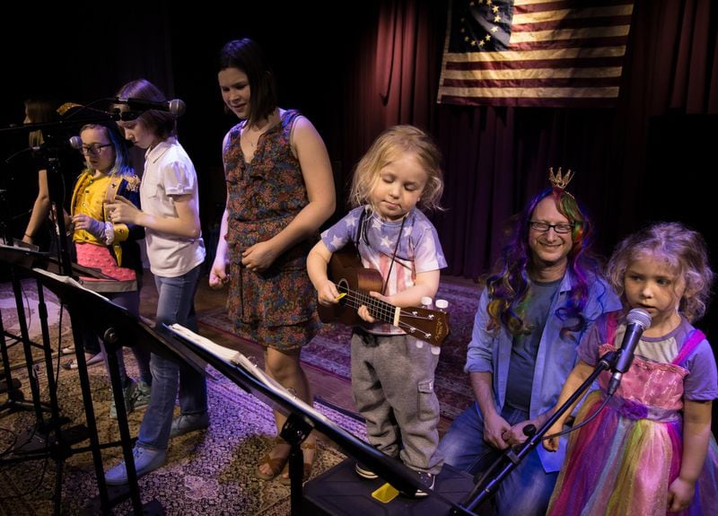 Two-year-old Emet Lewine strums his ukulele on stage during a recent all-ages sing-through at the Hamiltunes ATL. CONTRIBUTED BY STEVE SCHAEFER