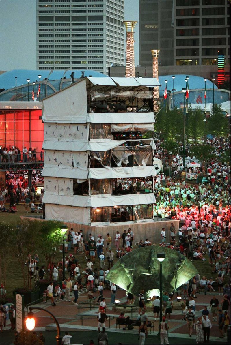 Tourists jam Centennial Olympic Park the night it reopens in Atlanta Tuesday July 30, 1996. The tower pictured is the site of the fatal bombing Saturday July 27,1996. (AP Photo/Michael Probst)