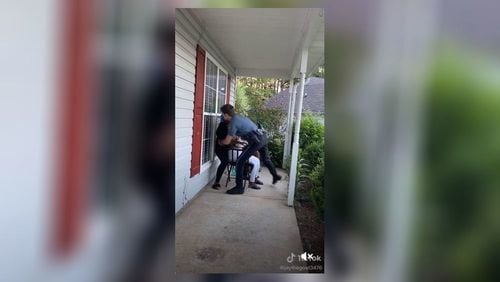 A Gwinnett County police officer has been placed on administrative duty pending an internal investigation into the arrest of a woman Tuesday on the front porch of a Loganville home.