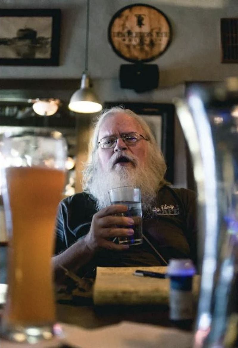 William Orten Carlton, seen here at the Hi-Lo Lounge, was a tireless promoter of craft beer, local music and camaraderie. Said Fred Schneider of the B-52s, "He was Athens." Photo: Courtesy of Red & Black/Lexi Kim